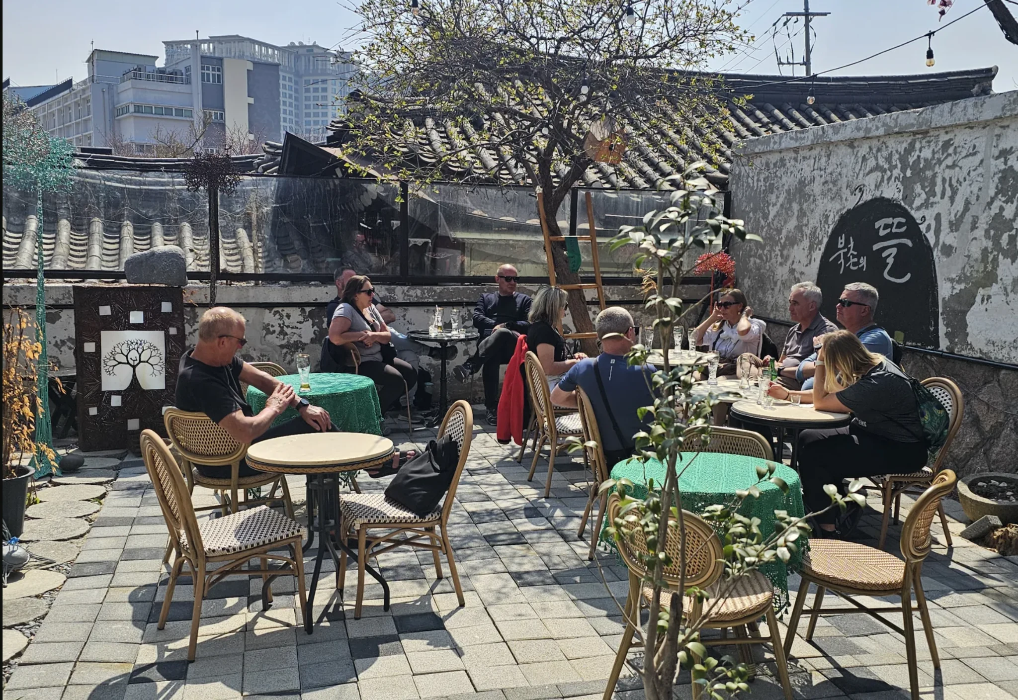 Foreign visitors enjoying the Bukchon Tteul courtyard